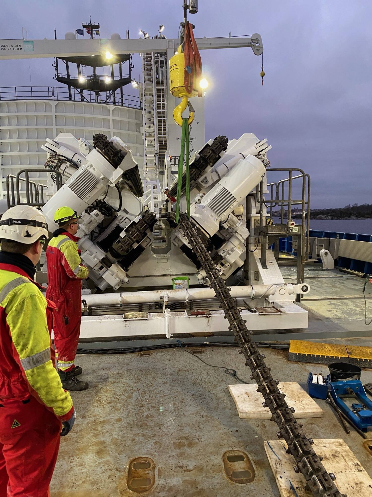 Crew working cable-handling equipment on deck during an offshore campaign